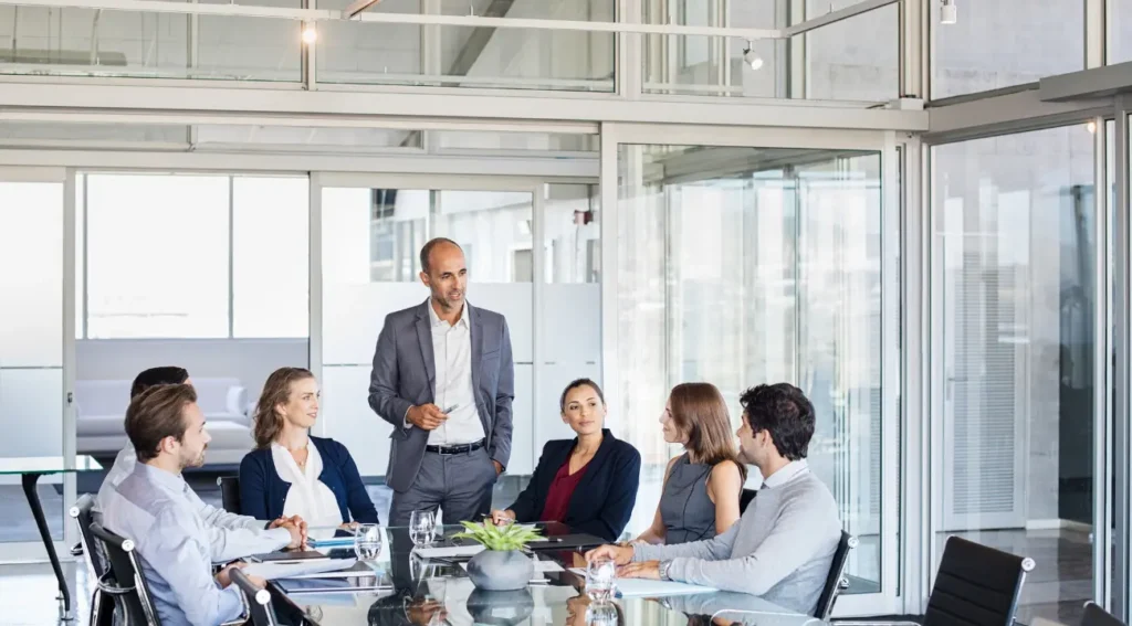 Business advisory team discussing investment and portfolio strategy in conference room